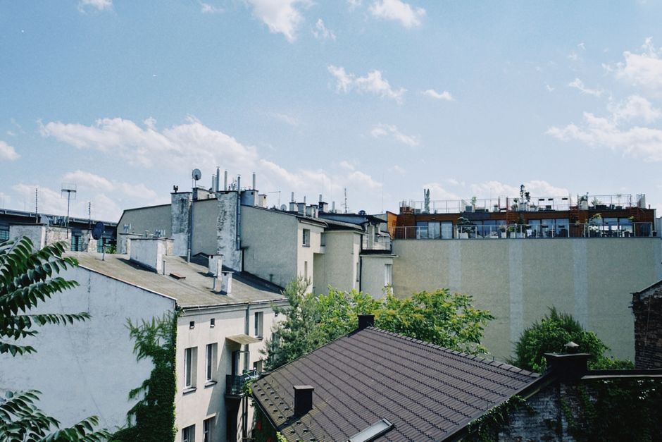 A picturesque view of Kraków's residential rooftops on a bright and sunny day
