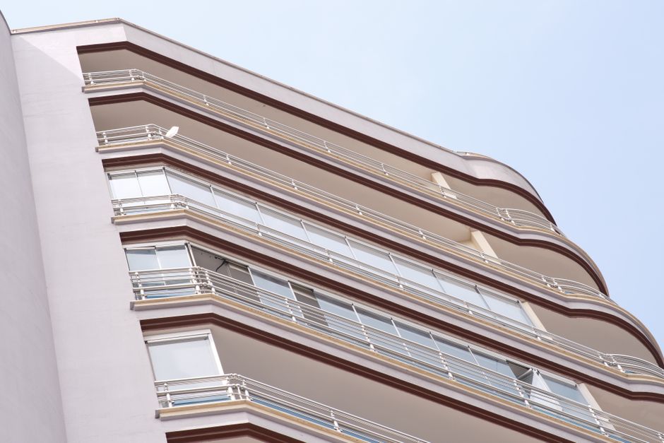Low angle view of a modern apartment building showcasing residential urban architecture